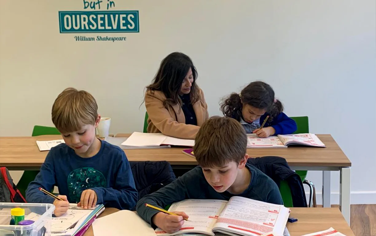 Tutor supporting a student at Top Mark Tuition Centre Chingford